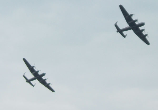2 Lancasters flying together.